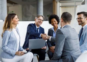 Two businessmen shaking hands after successful meeting