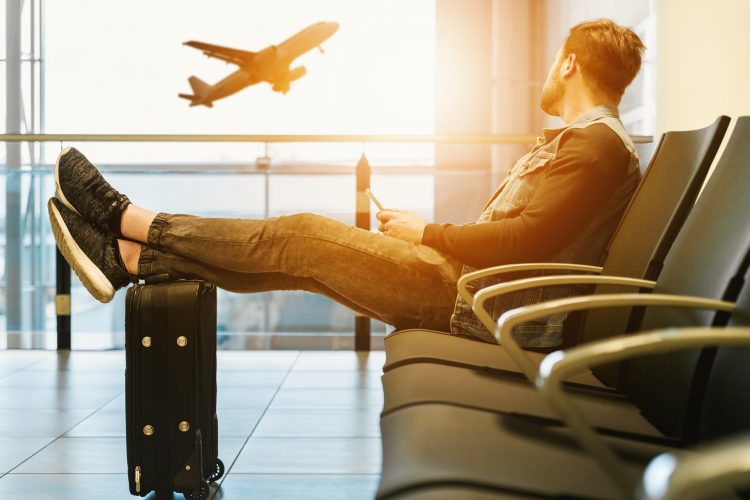 man at airport for a solo trip
