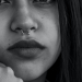 Septum piercing on a girl